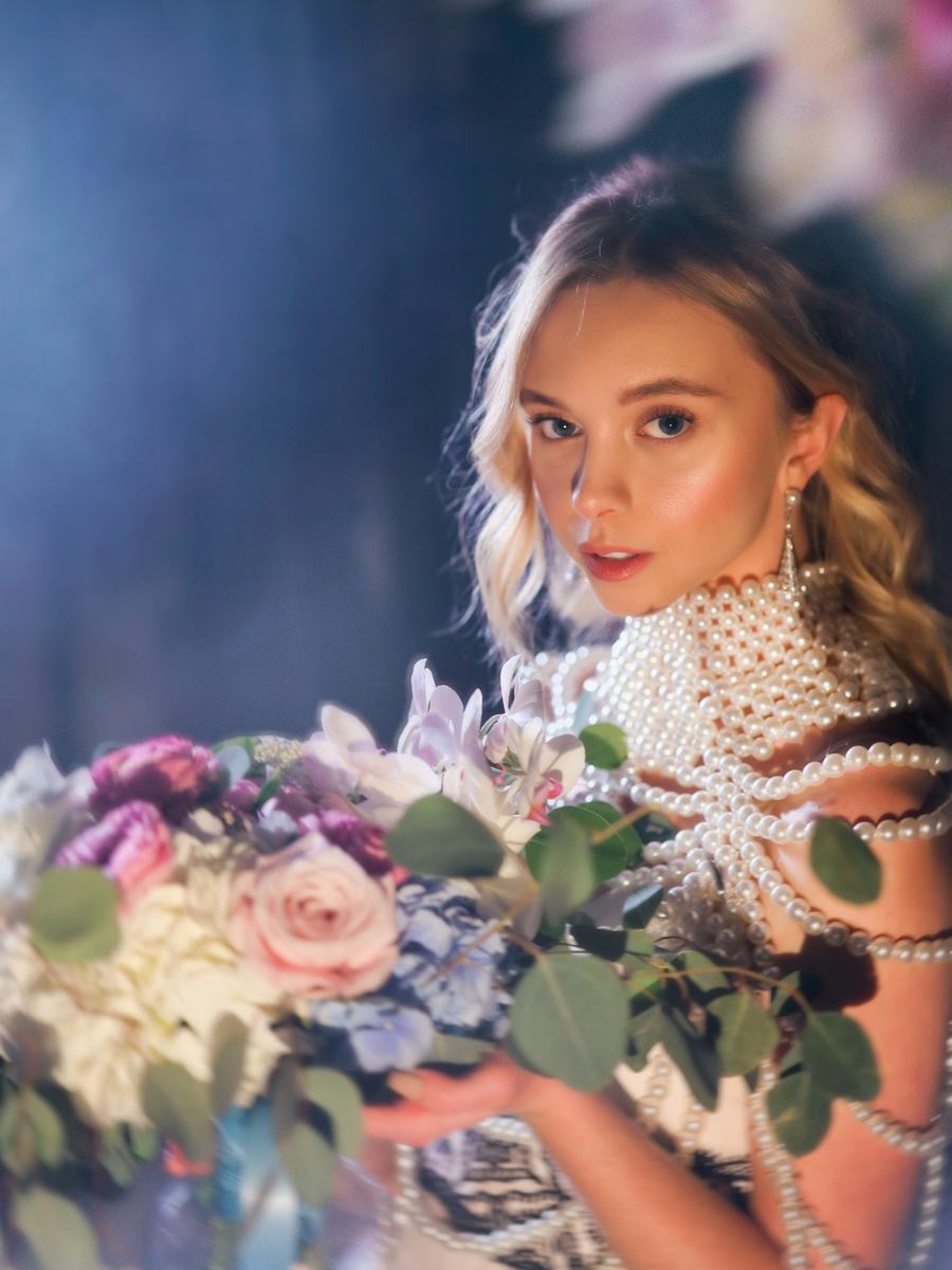 Pearls and a garden bouquet in cool, hazy light