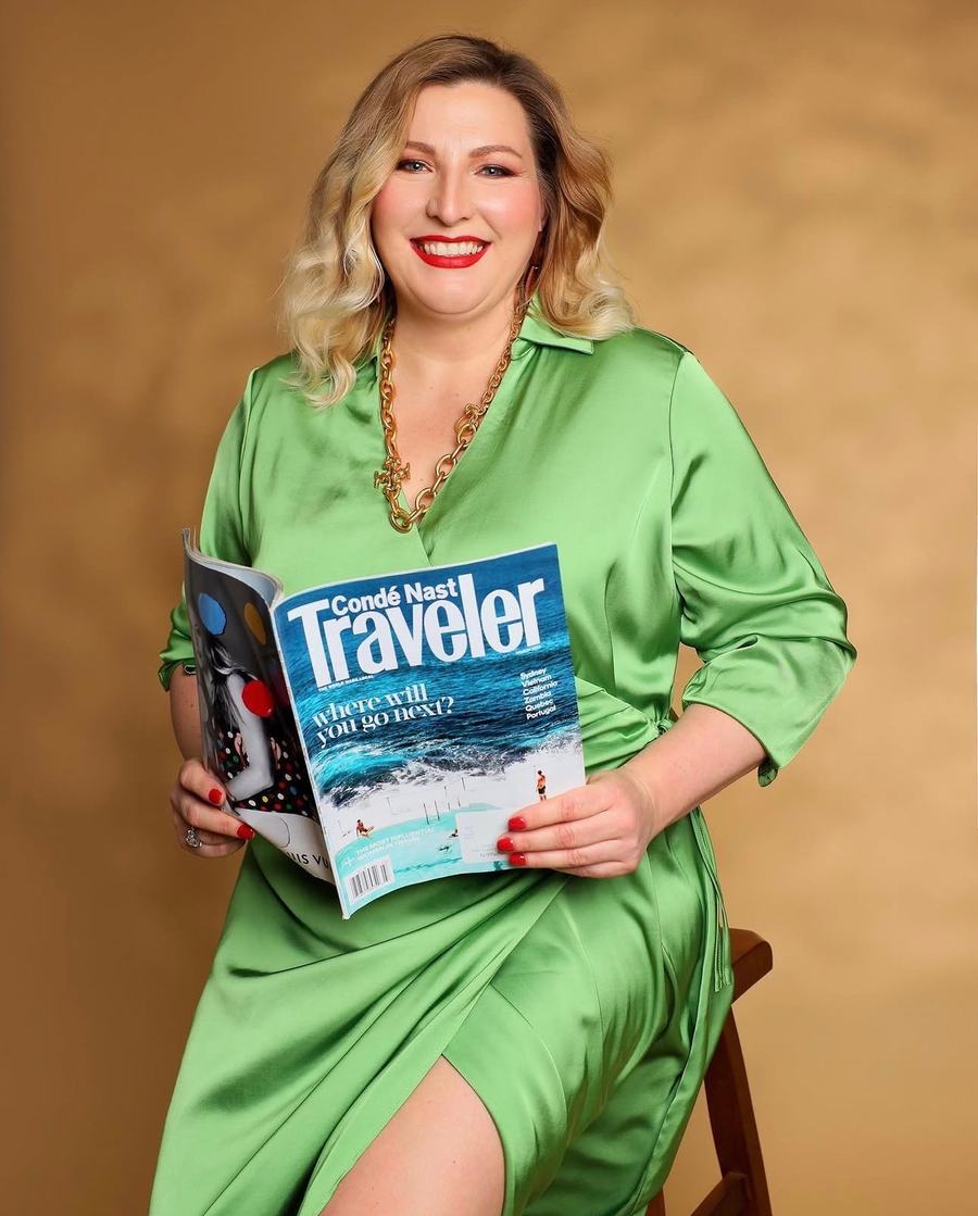 Green satin and a gold chain, a Condé Nast Traveler in hand